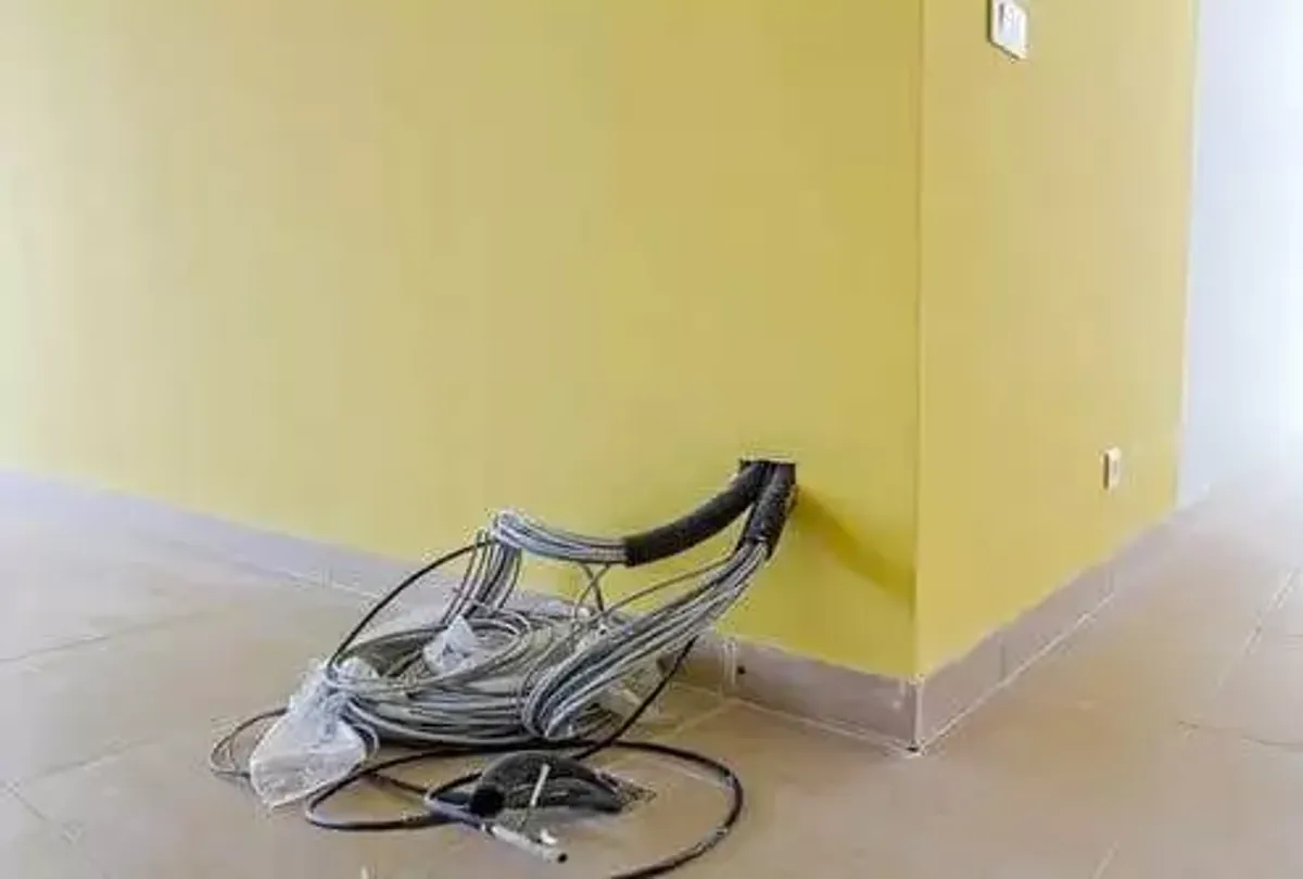 Engineer installing structured data cabling in a Leeds commercial office