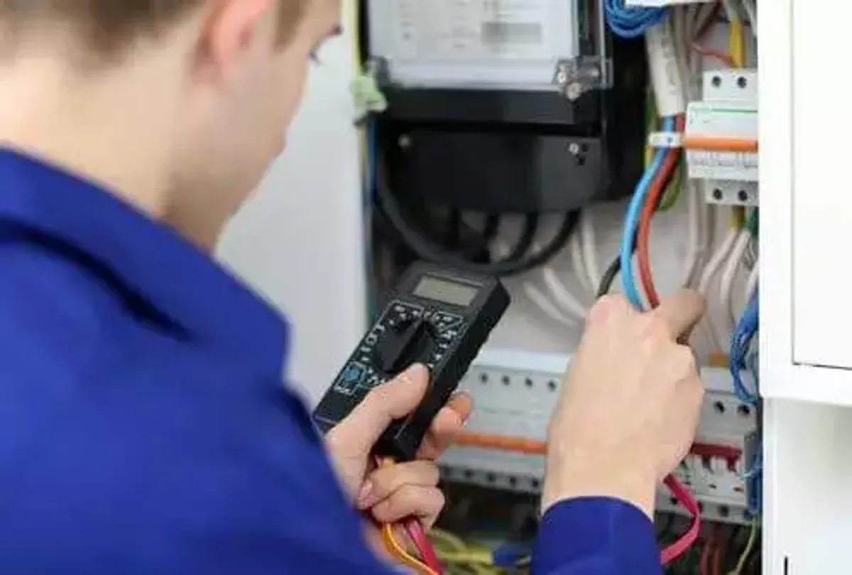 Engineer performing planned preventative electrical maintenance on a commercial site